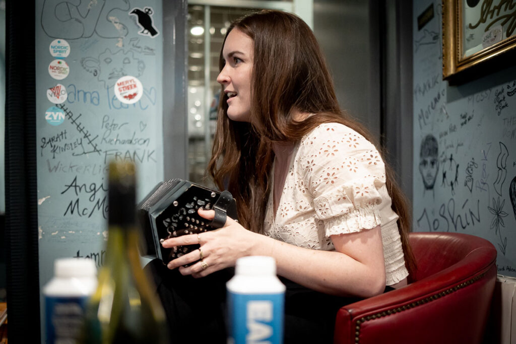 Kaitlin Cullen-Verhaeghe on the squeeze box in the green room – Irish Music Photography Ireland